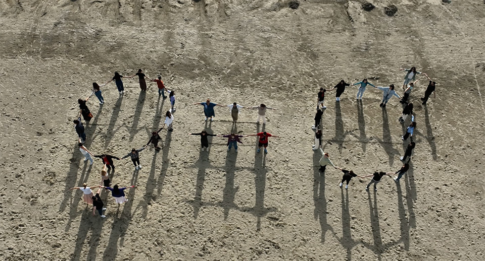 Students holding hands create the gender equality symbol in Durrës. Photo: UN Women Albania