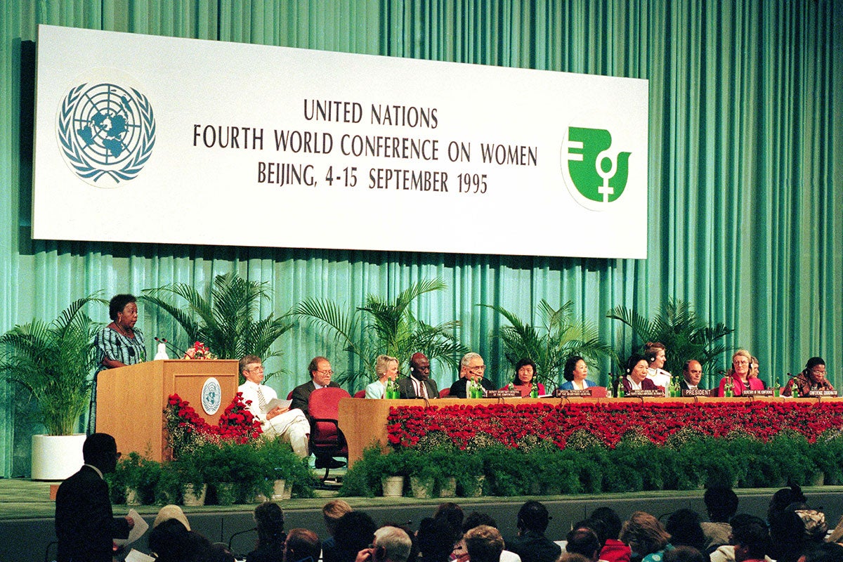 Gertrude Mongella (left, standing at the podium), Secretary-General of the Conference, addresses the session on 04 September 1995.  Photo: UN Photo/Milton Grant