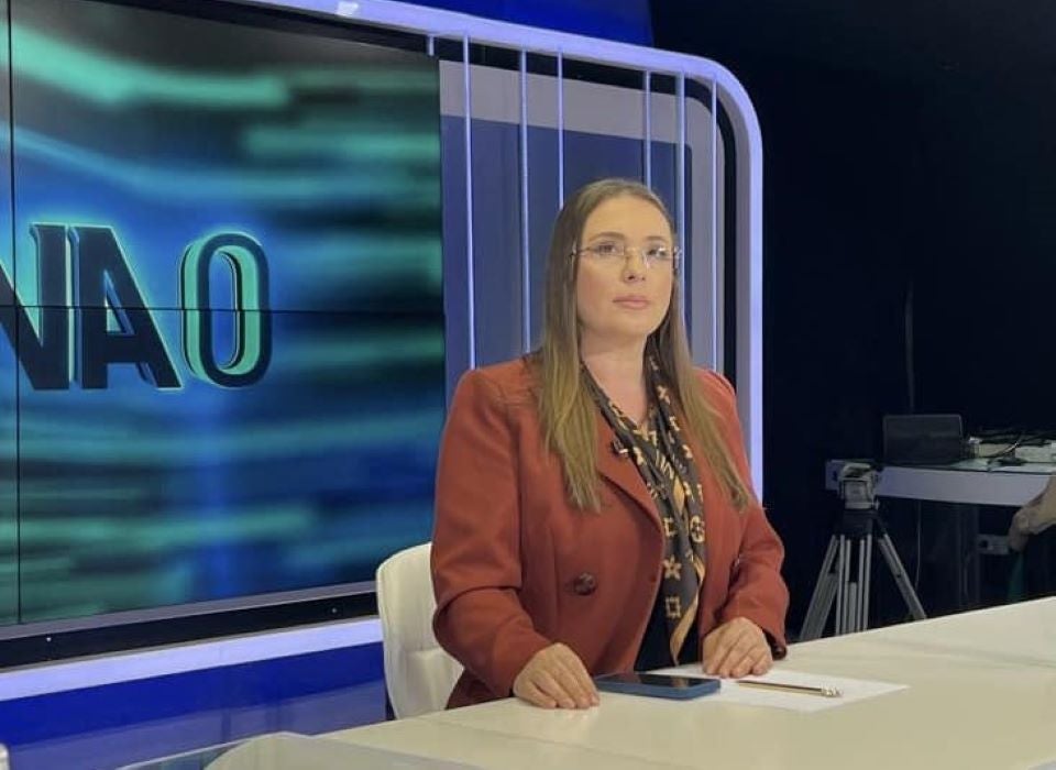 Anila Hoxha during a broadcast on Top Channel, an Albanian National TV station. Photo courtesy of her personal archive