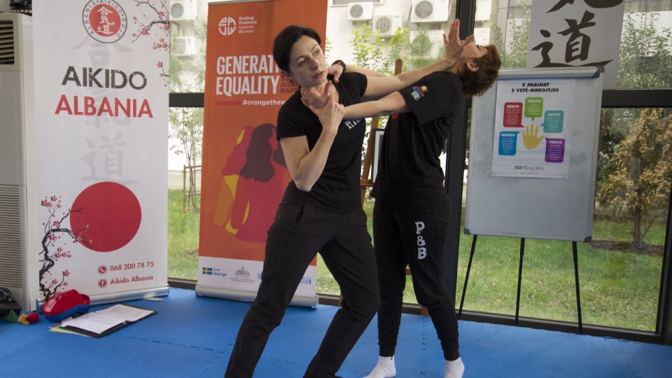 Gentiana Susaj (left), Aikido black belt (Shodan) and certified instructor for Empowerment through Self Defense with a participant during the training. Credit: UN Women Albania/Marsel Dajçi