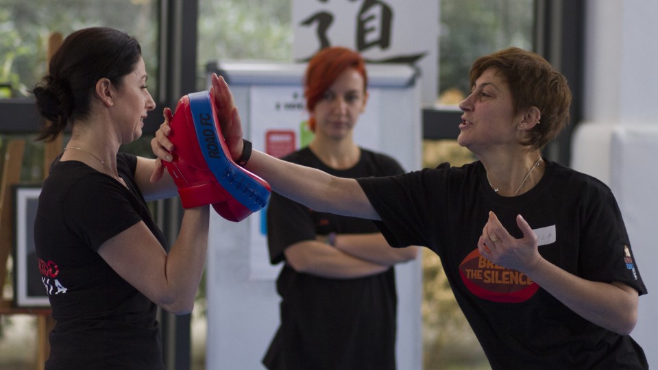 Gentiana Susaj (left), Aikido black belt (Shodan) and certified instructor for Empowerment through Self Defense with a participant during the training. Photo: UN Women Albania/Marsel Dajçi