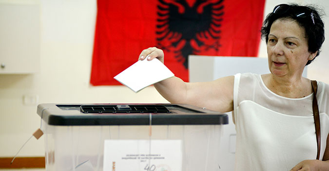 Photo: UN Women Albania/Violana Murataj. Woman voting at 2017 parliamentary elections in Albania